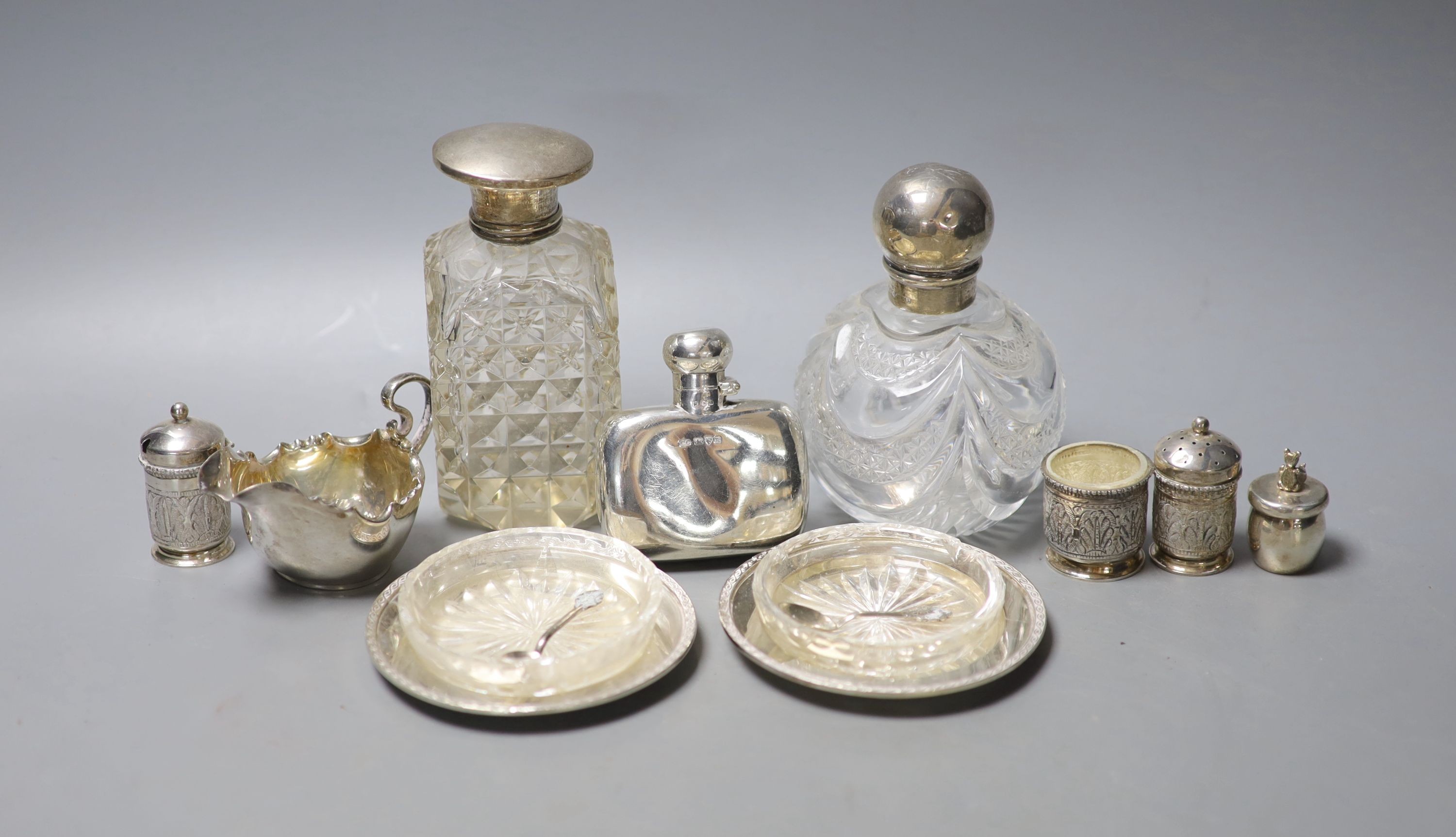 Mixed small silver including pair of silver dishes with glass liners, a silver hip flask, silver cream jug, scent bottles etc.